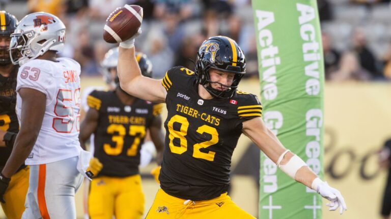Hamilton Tiger-Cats' Maximilian Mang (82) celebrates a touchdown against the B.C. Lions during first half CFL football action in Hamilton on Friday, June 19, 2026. (Nick Iwanyshyn/THE CANADIAN PRESS)