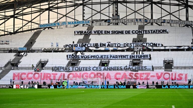 Banners protesting the club owner are placed on the stands during the French League One soccer match between Marseille and Strasbourg in Marseille, France, Feb. 14, 2026. (Philippe Magoni/AP)