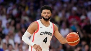 Canada's Jamal Murray dribbles in a men's basketball game against Australia at the 2024 Summer Olympics, Tuesday, July 30, 2024, in Villeneuve-d'Ascq, France. (Michael Conroy/AP)