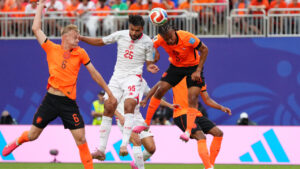 Tunisia's Anis Slimane jumps for the ball with Netherlands' Nathan Ake, right, and Jan Paul van Hecke during the World Cup Group F soccer match between Tunisia and the Netherlands in Kansas City, Mo., Thursday, June 25, 2026. (Ed Zurga/AP)