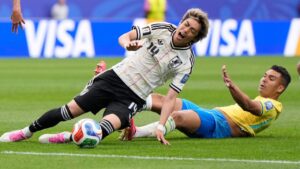 Brazil's Casemiro (5), background, stops Japan's Junya Ito (14) during the World Cup round of 32 soccer match between Brazil and Japan in Houston, Monday, June 29, 2026. (Ashley Landis/AP Photo)