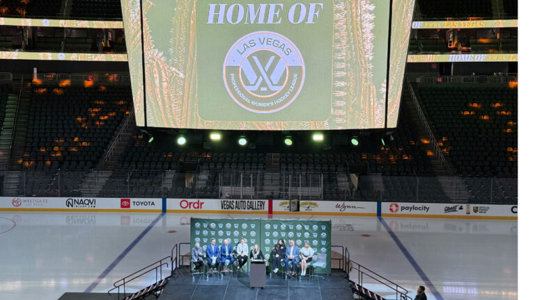 The NHL Network's Jamie Hersch, at podium, and officials announce the PWHL women's hockey expansion team beginning in the 2026-27 season, Wednesday, May 13, 2026 in Las Vegas. Hamilton, Ontario, also was added on Wednesday. (Mark Anderson/AP)