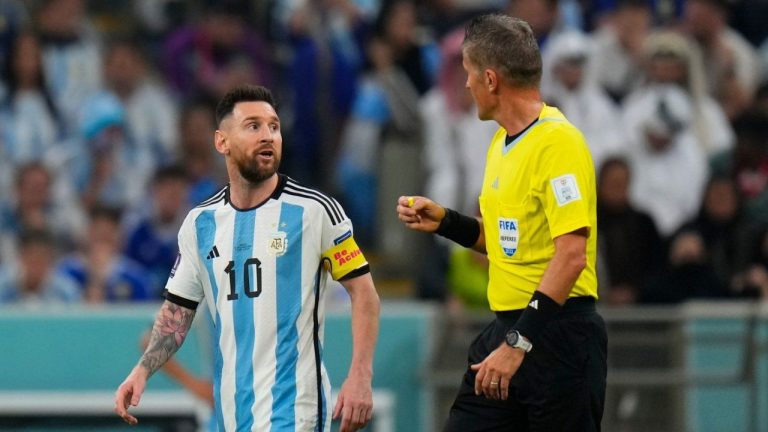 Referee Daniele Orsato talks to Argentina's Lionel Messi, left, during the World Cup semifinal soccer match between Argentina and Croatia at the Lusail Stadium in Lusail, Qatar, Dec. 13, 2022. (Petr David Josek/AP)