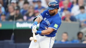 Toronto Blue Jays right fielder Anthony Santander (25) hits a single against the New York Yankees during the seventh inning of game 1 in MLB American League Division Series baseball action in Toronto on Saturday, October 4, 2025. (Nathan Denette/CP)