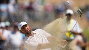 Scottie Scheffler hits from the bunker on the second hole during the third round of the U.S. Open golf tournament at Shinnecock Hills Golf Club in Southampton, N.Y., Saturday, June 20, 2026.(Gerald Herbert/AP Photo)