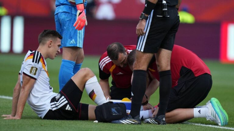 Germany's Nico Schlotterbeck receives treatment following an injury during the World Cup Group E soccer match between Germany and Ivory Coast in Toronto, Saturday, June 20, 2026. (Stephanie Scarbrough/AP)