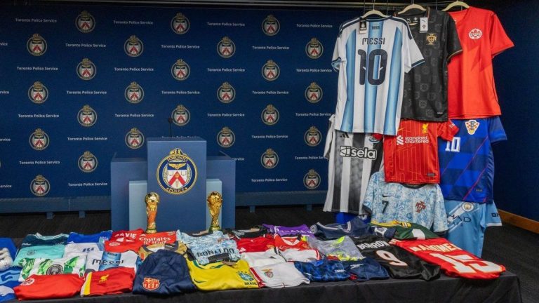 Toronto Police say they've arrested two people and seized more than 16,000 counterfeit sports merchandise items ahead of the FIFA World Cup, as they urge the public to only buy from trusted sellers and report suspected fraud. A small portion of the items seized is shown in this handout photo released by Toronto Police on Monday, June 1, 2026. (Handout - Toronto Police Service/CP)