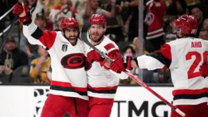 Carolina Hurricanes right wing Andrei Svechnikov, center, celebrates his goal with defenseman Shayne Gostisbehere, left, and center Sebastian Aho during the third period in Game 3 of the NHL hockey Stanley Cup Final series against the Vegas Golden Knights, Saturday, June 6, 2026, in Las Vegas. (John Locher/AP)