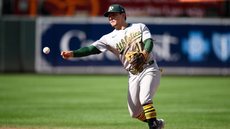 Athletics second base Luis Urías throws to first base to put out Baltimore Orioles' Dylan Carlson during the ninth inning of a baseball game, Sunday, Aug. 10, 2025, in Baltimore. (Nick Wass/AP)