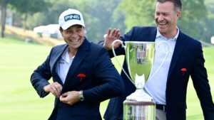 Viktor Hovland, of Norway, reacts as he places the Travelers Championship golf jacket on as tournament director Nathan Grube, right, looks on at TPC River Highlands, Monday, June 29, 2026, in Cromwell, Conn. (Jessica Hill/AP)