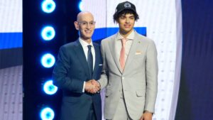 Keaton Wagler, right, poses for a photo with NBA Commissioner Adam Silver, left, after being selected by the Los Angeles Clippers in the first round of the NBA basketball draft, Tuesday, June 23, 2026, in New York. (Yuki Iwamura/AP)