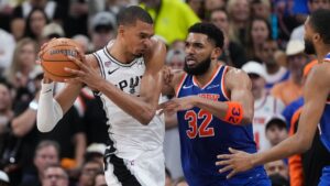 San Antonio Spurs forward Victor Wembanyama drives on New York Knicks centre Karl-Anthony Towns (32) during the second half of Game 2 of the NBA Finals basketball series, Friday, June 5, 2026, in San Antonio. (Eric Gay/AP)