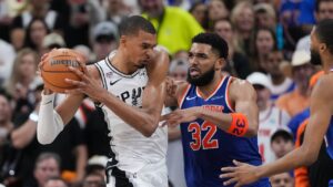 San Antonio Spurs star Victor Wembanyama drives on New York Knicks centre Karl-Anthony Towns (32) during the second half of Game 2 of the NBA Finals basketball series, Friday, June 5, 2026, in San Antonio. (Eric Gay/AP Photo)
