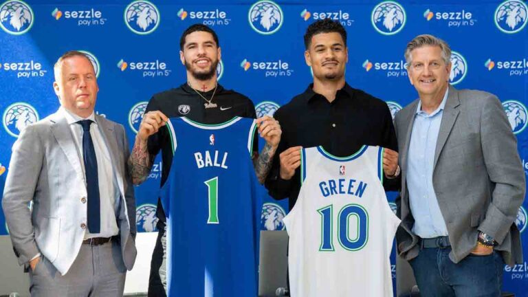 Tim Connelly, Minnesota Timberwolves president of basketball operations, newly acquired guards LaMelo Ball and Josh Green and head coach Chris Finch pose for a photo after an introductory press conference at the Target Center in Minneapolis on Tuesday, July 14, 2026. (Alex Kormann/Minnesota Star Tribune via AP)