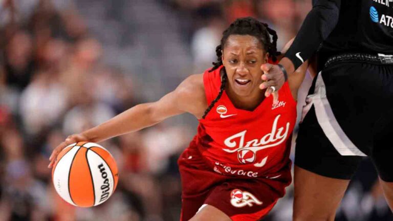 Indiana Fever guard Kelsey Mitchell (0) drives against Las Vegas Aces forward Cheyenne Parker-Tyus (32) during the first half of an WNBA basketball game Sunday, July 5, 2026, in Las Vegas. (Steve Marcus/Las Vegas Sun via AP)