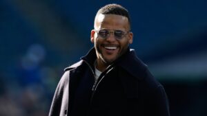 Former NFL player Aaron Donald watches as players warm up before the NFC Championship NFL football game between the Seattle Seahawks and the Los Angeles Rams, Sunday, Jan. 25, 2026, in Seattle. (Godofredo A. Vásquez/AP)