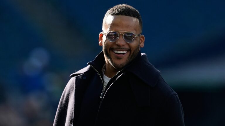 Former NFL player Aaron Donald watches as players warm up before the NFC Championship NFL football game between the Seattle Seahawks and the Los Angeles Rams, Sunday, Jan. 25, 2026, in Seattle. (Godofredo A. Vásquez/AP)