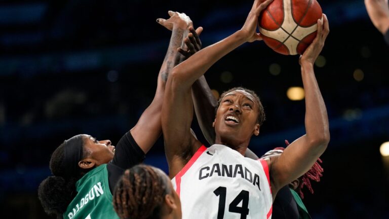 Kayla Alexander (14), of Canada, shoots over Elizabeth Balogun (4), of Nigeria, in a women's basketball game at the 2024 Summer Olympics, Sunday, Aug. 4, 2024, in Villeneuve-d'Ascq, France. (Mark J. Terrill/AP)