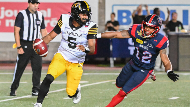 Montreal Alouettes' Najee Murray (12) chases down Hamilton Tiger-Cats quarterback Tre Ford (5) during second half CFL football action in Montreal, on Sunday, July 26, 2026. (Graham Hughes/CP)