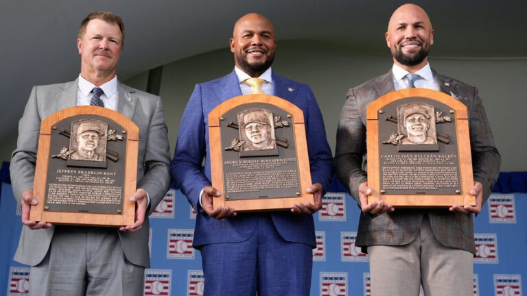 The 2026 Baseball Hall of Fame inductees Jeff Kent, left, Andruw Jones, centre, and Carlos Beltran pose for pictures after the induction ceremony in Cooperstown, N.Y., Sunday, July 26, 2026. (Seth Wenig/AP)
