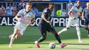 United States' Folarin Balogun (20) moves the ball against Belgium's Timothy Castagne (21) during the World Cup round of 16 soccer match in Seattle, Monday, July 6, 2026. (Ted S. Warren/AP)