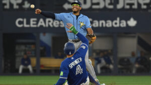 Tampa Bay Rays second baseman Richard Palacios (1) throws to first base to complete a double play after forcing out Toronto Blue Jays' George Springer (4) during sixth inning MLB baseball action in Toronto on Monday, July 20, 2026. (Jon Blacker/CP)