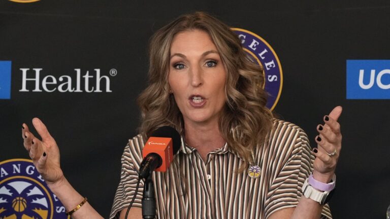 Lynne Roberts, left, is introduced as the Los Angeles Sparks new head basketball coach by Sparks general manager Raegan Pebley, right, at a WNBA news conference at Crypto.com Arena in Los Angeles, Thursday, Nov. 21, 2024. (AP Photo/Damian Dovarganes)