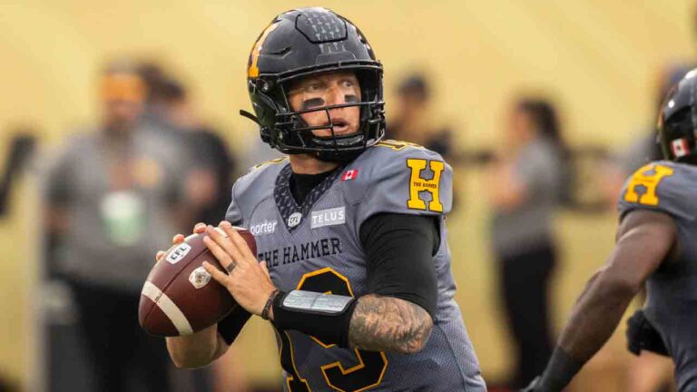 Hamilton Tiger-Cats quarterback Bo Levi Mitchell (19) looks for a pass during first half CFL football action against the Winnipeg Blue Bombers, in Hamilton on Sunday, July 5, 2026. (Nick Iwanyshyn/CP)