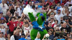 The Philadelphia Phillies' mascot, the Phillie Phanatic performs a skit inspired by new Philadelphia 76ers LeBron James during the sixth inning of a baseball game against the New York Yankees Friday, July 24, 2026, in Philadelphia. (Matt Slocum/AP)