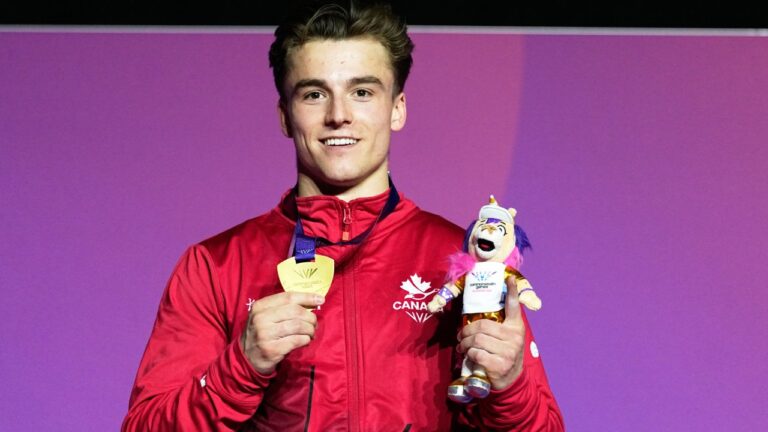 Felix Dolci of Canada poses for a photograph with his gold medal after winning the Men's Vault final of Artistic Gymnastics at the Commonwealth Games in Glasgow, Scotland, Tuesday, July 28, 2026. (AP Photo/Manish Swarup)