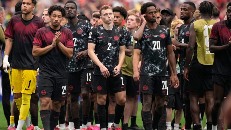 Canada's players react after losing in the Round of 16 against Morocco at the FIFA World Cup. (Ashley Landis/AP)
