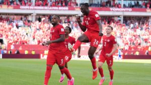 Canada's Cyle Larin (9) celebrates after scoring his sides first goal of the game with Promise David (24) in the second half of the World Cup Group B soccer match between Canada and Bosnia, Friday, June 12, 2026, in Toronto. (Sam Balkansky/AP)