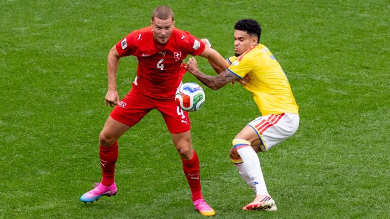 Colombia’s Luis Diaz (7) challenges Switzerland’s Nico Elvedi (4) during the first half of a World Cup round of 16 match, in Vancouver, on Tuesday, July 7, 2026. (Timothy Matwey/CP)