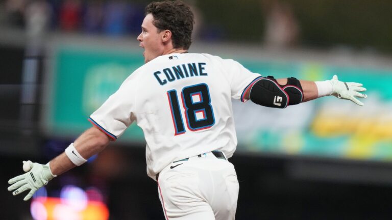 Miami Marlins' Griffin Conine (18) reacts after hitting a walk off single to score Heriberto Hernández and defeat the Philadelphia Phillies in the the ninth inning of a baseball game, Monday, July 27, 2026, in Miami. (AP Photo/Lynne Sladky)