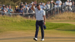 Bryson DeChambeau of the United States waves to the crowd as he walks to the 18th green during the third day of the British Open Golf championships at Royal Birkdale golf club, in Southport, England, Saturday, July 18, 2026. (Jon Super/AP)