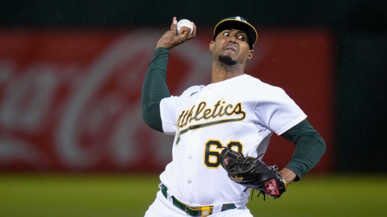 Former Oakland Athletics pitcher Domingo Acevedo throws against the Seattle Mariners during the seventh inning of a baseball game in Oakland, Calif., Wednesday, May 3, 2023. (AP Photo/Godofredo A. Vásquez)