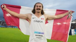Ethan Katzberg, of Canada, poses after winning the gold medal in the men's hammer throw final at the Commonwealth Games in Glasgow, Scotland, Monday, July 27, 2026. (Alastair Grant/AP)