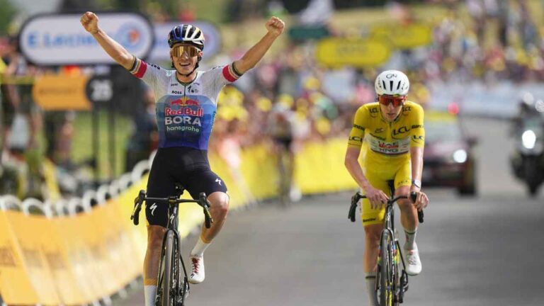 Belgium's Remco Evenepoel celebrates as he crosses the finish line ahead Slovenia's Tadej Pogacar to win the fifteenth stage of the Tour de France cycling race, from Champagnole to the Plateau de Solaison, France. (Thibault Camus/AP)