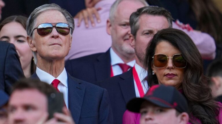 Liverpool owner John Henry and his wife Linda Pizzuti take their seats before the English Premier League soccer match between Liverpool and Tottenham Hotspur at Anfield in Liverpool, England, Sunday, April 27, 2025. (Jon Super/AP)