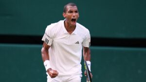 Felix Auger-Aliassime of Canada celebrates winning the second set during the men's quarter-final singles match Novak Djokovic of Serbia against at the Wimbledon Tennis Championships in London, Tuesday, July 7, 2026. (Kirsty Wigglesworth/AP)