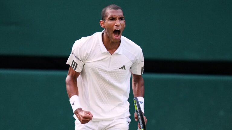 Felix Auger-Aliassime of Canada celebrates winning the second set during the men's quarter-final singles match Novak Djokovic of Serbia against at the Wimbledon Tennis Championships in London, Tuesday, July 7, 2026. (Kirsty Wigglesworth/AP)