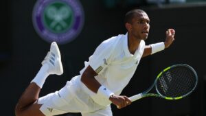 Felix Auger-Aliassime of Canada plays a return during the men's singles fourth round match against Alejandro Davidovich Fokina of Spain at the Wimbledon Tennis Championships in London, Sunday, July 5, 2026. (Kin Cheung/AP)