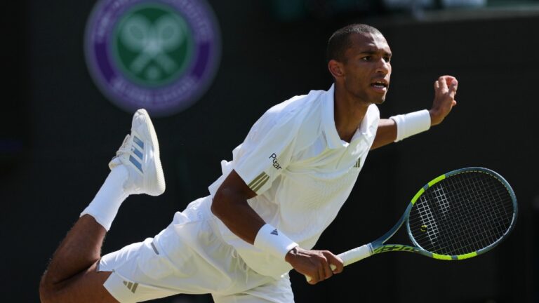 Felix Auger-Aliassime of Canada plays a return during the men's singles fourth round match against Alejandro Davidovich Fokina of Spain at the Wimbledon Tennis Championships in London, Sunday, July 5, 2026. (Kin Cheung/AP)
