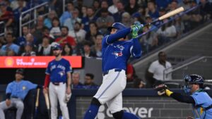 Toronto Blue Jays' George Springer hits a single against the Tampa Bay Rays during first inning MLB baseball action in Toronto on Tuesday, July 21, 2026. (Jon Blacker/CP)