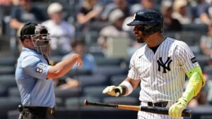 New York Yankees' Jose Caballero reacts after striking out in front of home plate umpire Quinn Wolcott (81) in the sixth inning during the first baseball game of a doubleheader against the Pittsburgh Pirates, Wednesday, July 22, 2026, in New York. (Adam Hunger/AP)