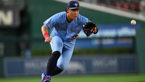 Toronto Blue Jays third baseman Kazuma Okamoto fields a ground ball to throw out Washington Nationals' Dylan Crews during the fifth inning of a baseball game, Monday, July 27, 2026, in Washington. (AP Photo/John McDonnell)