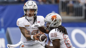 B.C. Lions quarterback Kaidon Salter (19) hands off to Emani Bailey (25) during first half CFL football action against the Winnipeg Blue Bombers in Winnipeg on Thursday, July 30, 2026. (John Woods/CP)