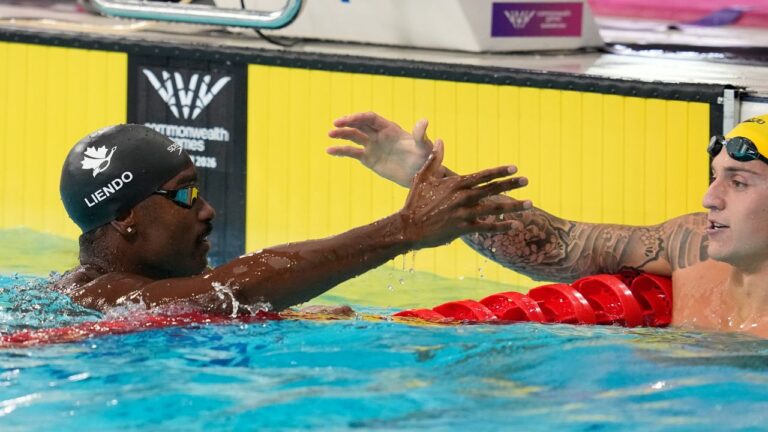 Canada's Joshua Liendo, left and Australia's Flyn Southam celebrate after competing in the men's 50 meter freestyle semifinal swimming event at the Commonwealth Games in Glasgow, Scotland, Saturday, July 25, 2026. (Manish Swarup/AP)