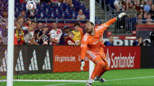 Toronto FC goalkeeper Luka Gavran deflects the ball from the net in the first half of an MLS soccer match against the New England Revolution, Wednesday, July 22, 2026, in Foxborough, Mass. (Mark Stockwell/AP)