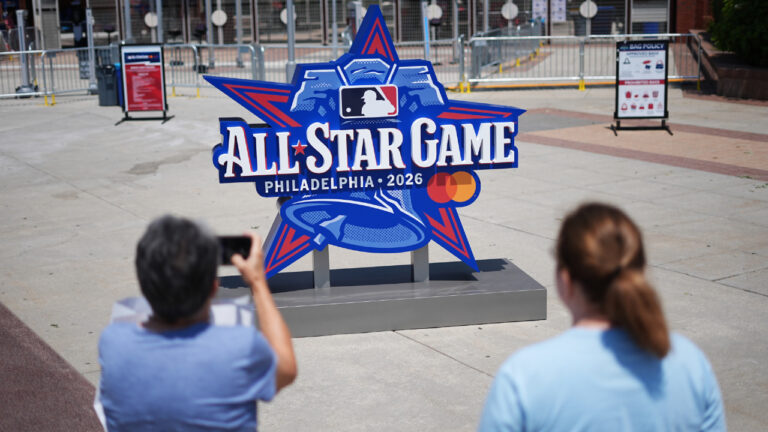 People take photos of the All-Star Game logo ahead of the home run derby on Monday, July 13, 2026, in Philadelphia. (Matt Rourke/AP)